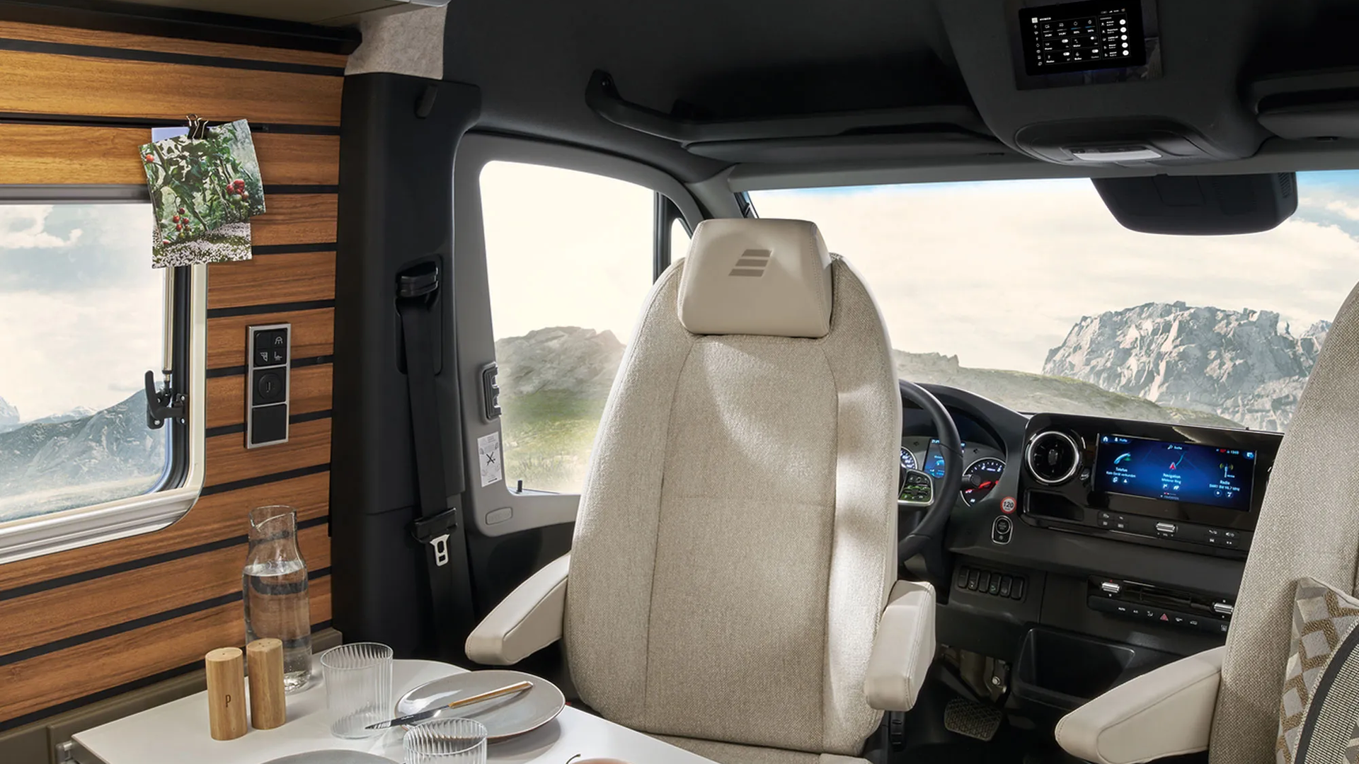 The HYMER Connect display inside the HYMER Grand Canyon S is centrally positioned facing the living area above the driver's seats.