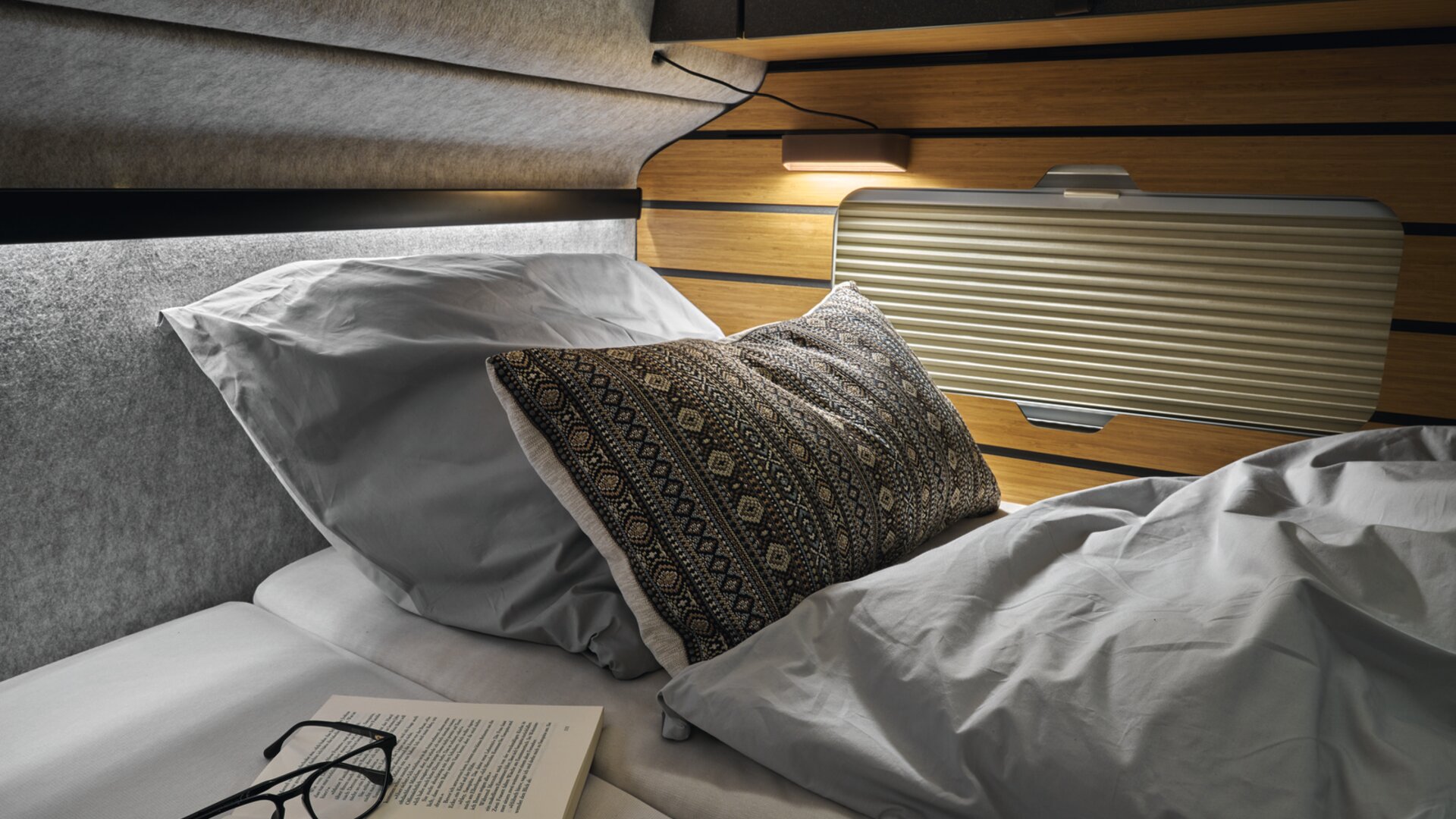 You no longer run the risk of bumping your head thanks to the redesigned overhead lockers at the head of the bed.